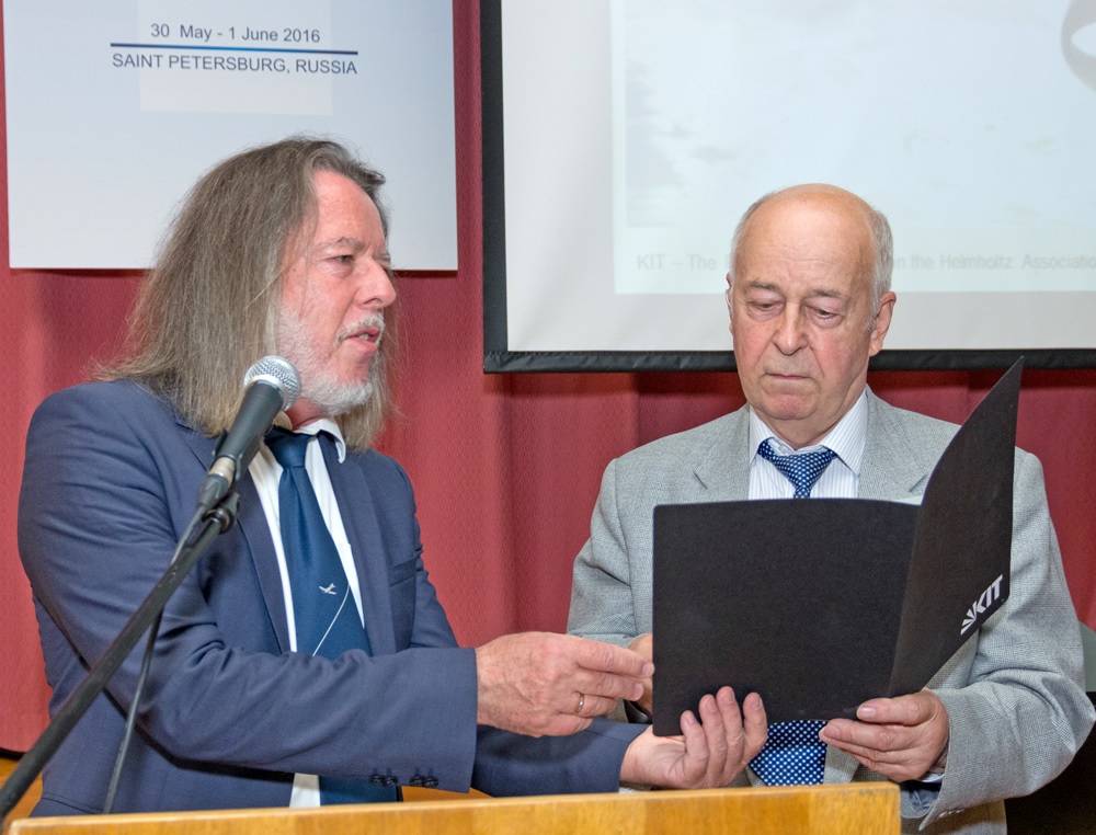 Prof. G.Trommer (Germany) hands Certificate of Appreciation to Prof. D. Lukyanov (Russia)